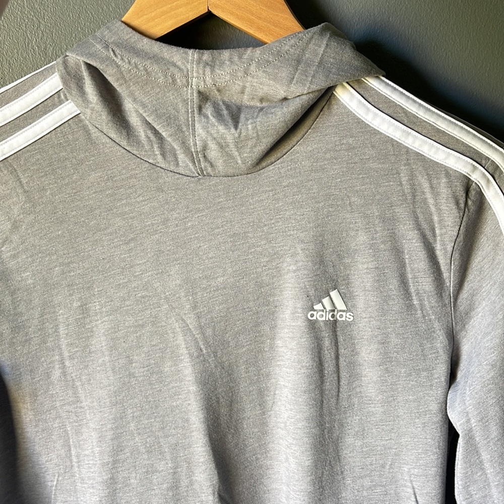 Rarely worn Adidas long sleeved gray/silver top with white stripes on sleeve.